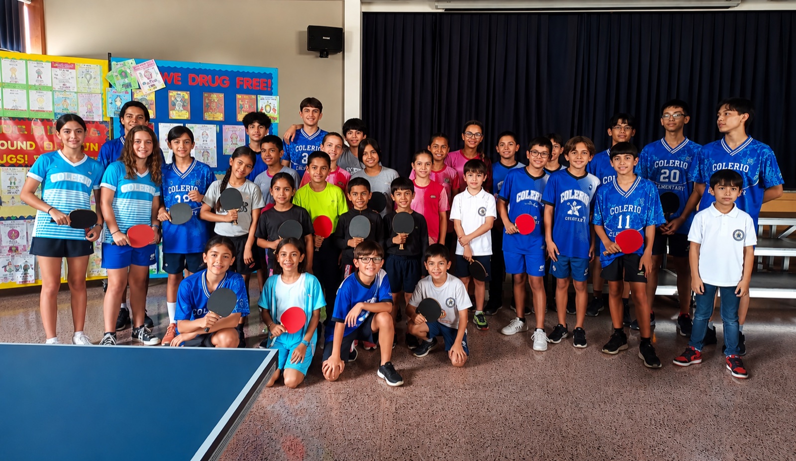 Damasio Table Tennis Academy group with their paddles